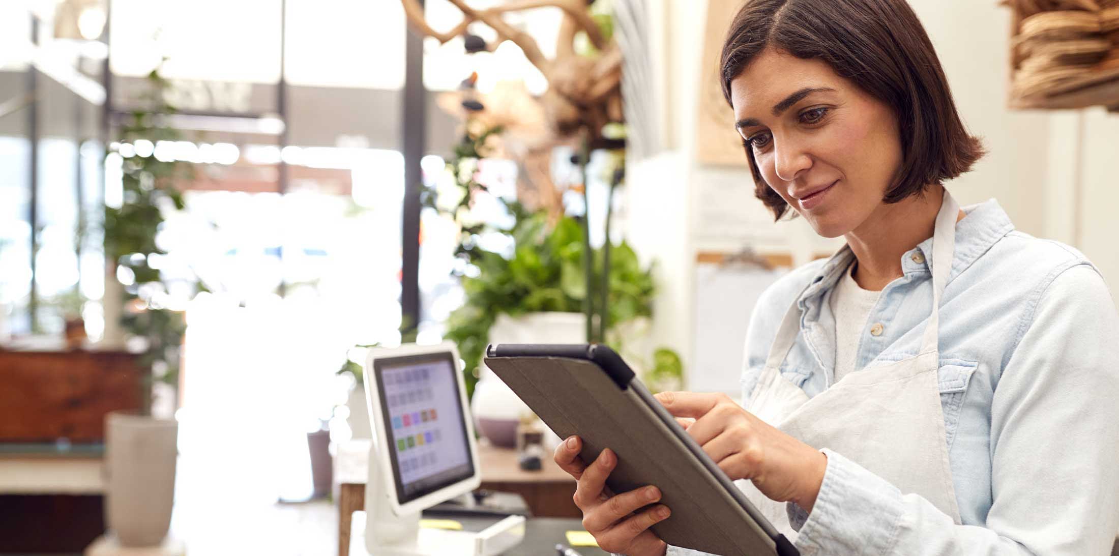 image of woman using tablet at work