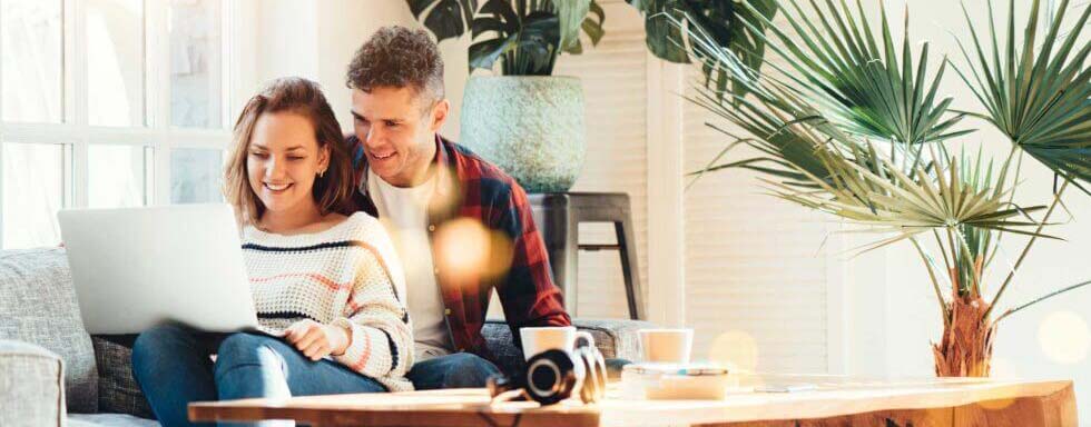 Couple using laptop