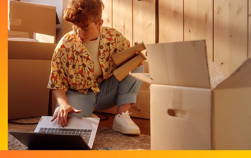 Exist-Customers-2 Woman using laptop in new home